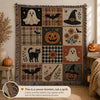 A woven Halloween-themed blanket with patchwork-style panels featuring ghosts, pumpkins, a witch hat, bats, a black cat, plaid, and floral motifs, hanging in a styled room with pumpkins and a window. A circular inset shows the woven texture, and a caption at the bottom reads, 'This is a woven blanket, not a quilt.